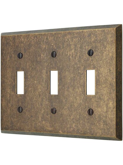 Traditional Forged Brass Triple Toggle Switch in Antique Brass.